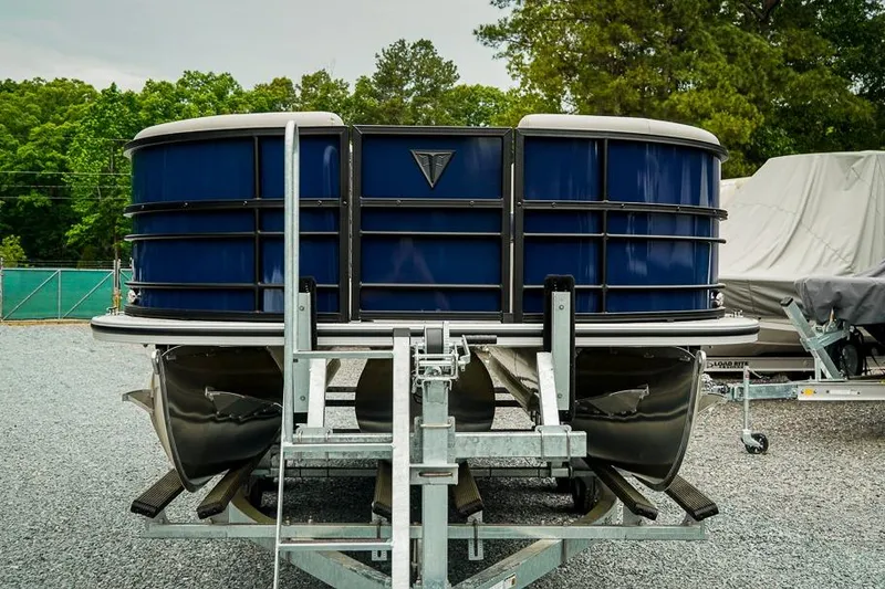 Slide: The Image of 2026 Trifecta LE 22RF pontoon boat on trailer, parked outdoors. - 6