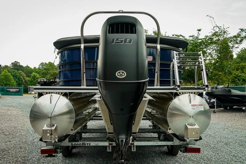 Slide: The Image of 2026 Trifecta LE 22RF pontoon boat with 150 HP engine on trailer. - 7