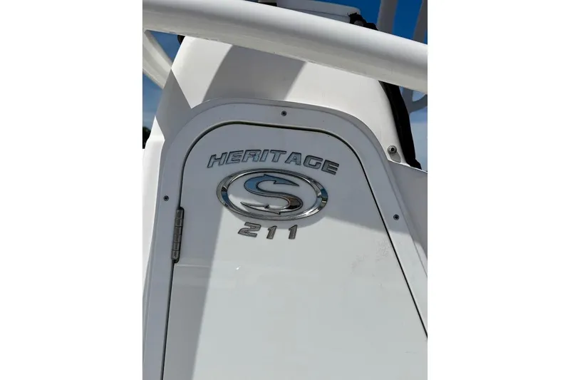 Slide: The Image of 2020 Sportsman Heritage 211 Center Console boat emblem close-up. - 14