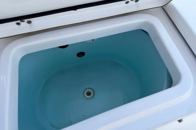 Slide: The Image of Livewell compartment on 2020 Sportsman Heritage 211 Center Console boat. - 17