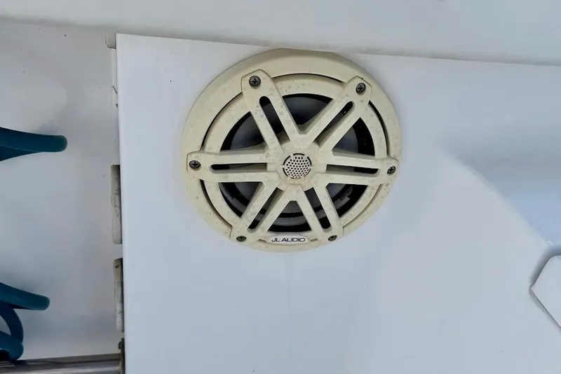 Slide: The Image of JL Audio speaker on 2020 Sportsman Heritage 211 Center Console boat. - 20