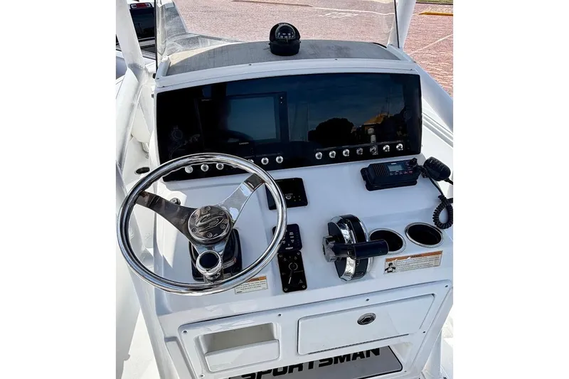 Slide: The Image of 2020 Sportsman Heritage 211 Center Console dashboard with steering wheel and controls. - 22