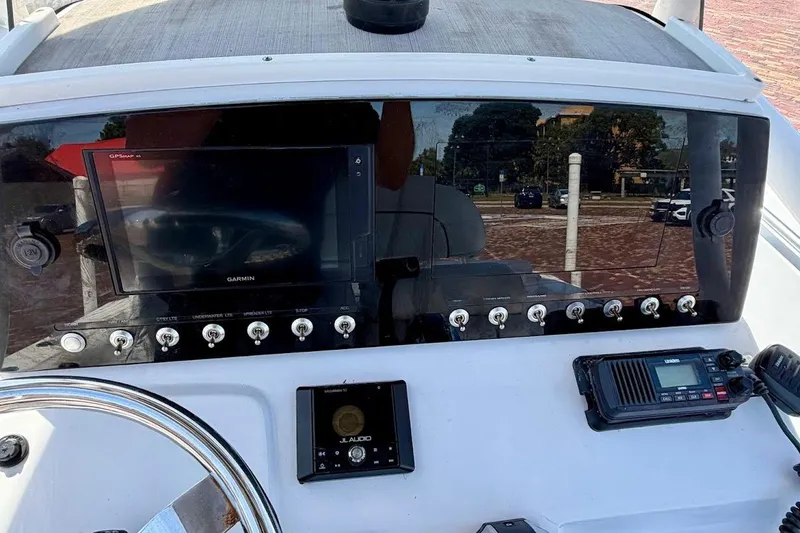 Slide: The Image of 2020 Sportsman Heritage 211 Center Console dashboard with Garmin GPS and JL Audio system. - 23