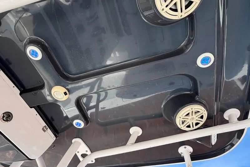 Slide: The Image of 2020 Sportsman Heritage 211 Center Console boat underside with speakers and lights. - 24