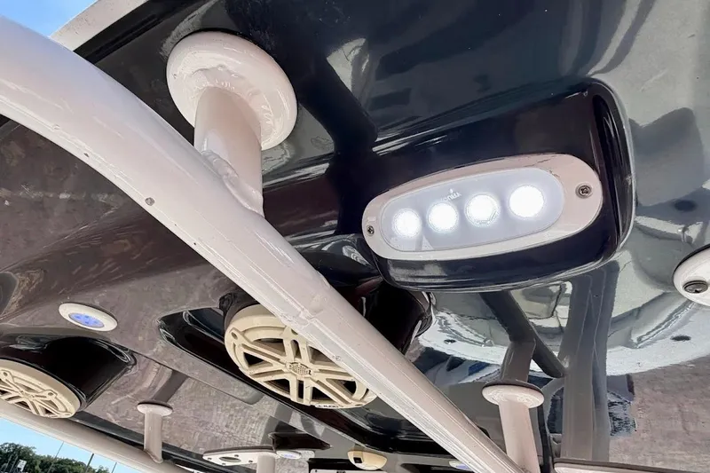Slide: The Image of 2020 Sportsman Heritage 211 Center Console boat with LED lights and speakers on the ceiling. - 25