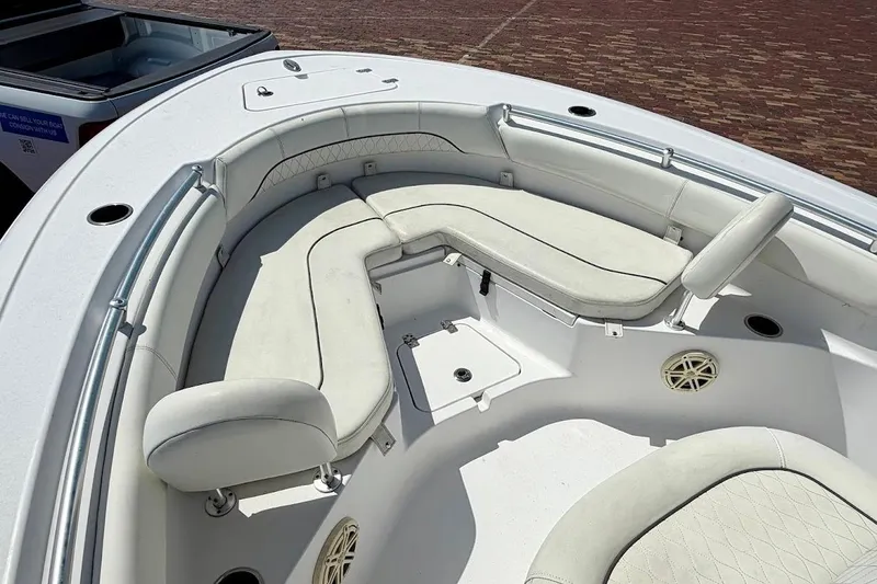 Slide: The Image of 2020 Sportsman Heritage 211 Center Console boat with cushioned seating area. - 27