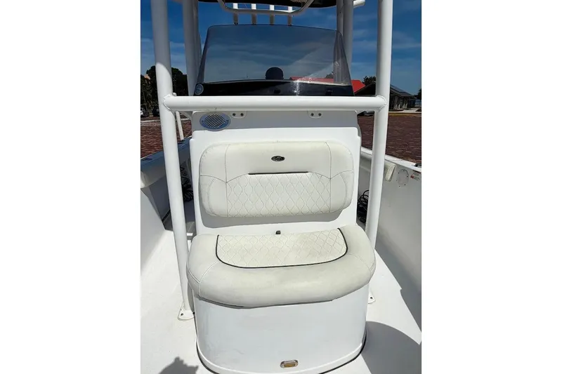 Slide: The Image of 2020 Sportsman Heritage 211 Center Console boat with white cushioned seating. - 28