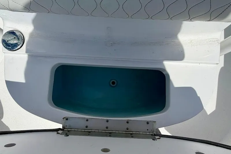 Slide: The Image of 2020 Sportsman Heritage 211 Center Console boat's livewell with open lid. - 29