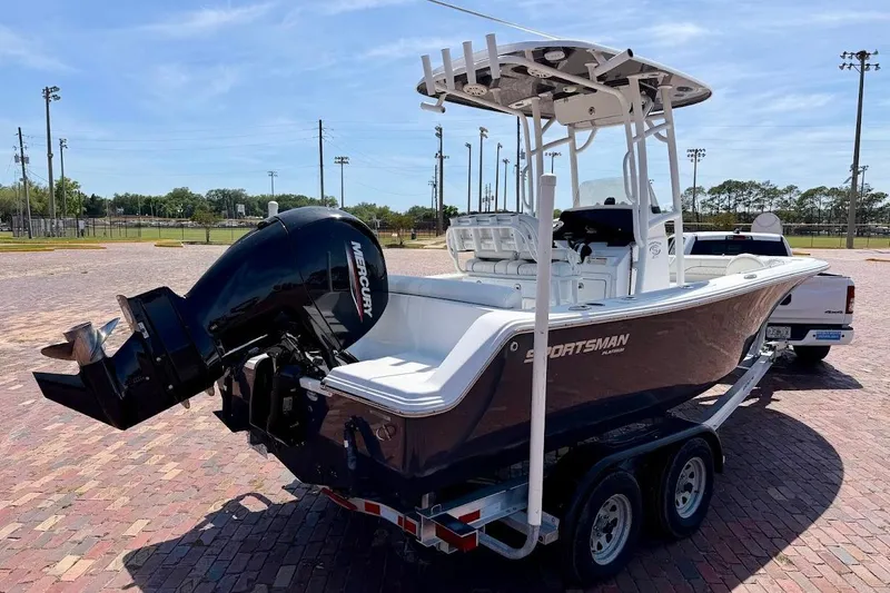 Slide: The Image of 2020 Sportsman Heritage 211 Center Console boat on trailer, featuring Mercury outboard engine. - 3