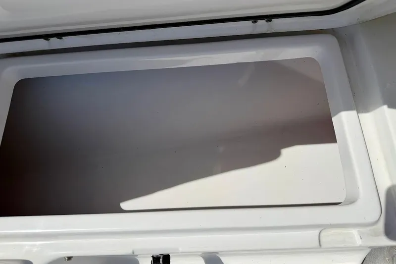 Slide: The Image of Open storage compartment on 2020 Sportsman Heritage 211 Center Console boat. - 32