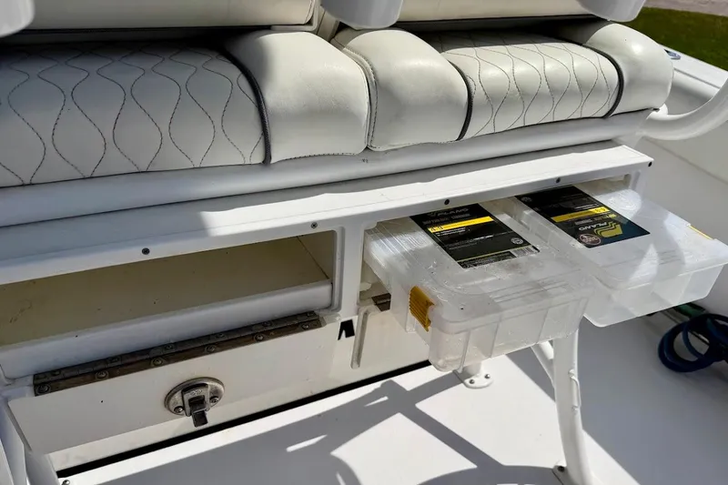 Slide: The Image of Storage compartments on a 2020 Sportsman Heritage 211 Center Console boat with tackle boxes. - 36