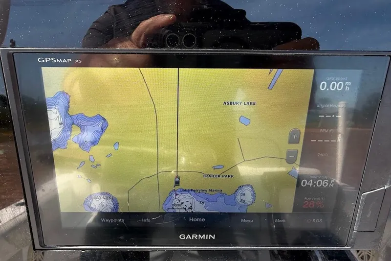 Slide: The Image of Garmin GPS display on 2020 Sportsman Heritage 211 Center Console boat, showing Asbury Lake map. - 39