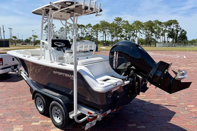 Slide: The Image of 2020 Sportsman Heritage 211 Center Console boat on trailer, featuring Mercury outboard motor. - 4