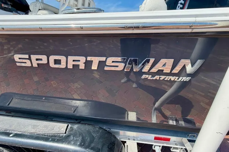 Slide: The Image of 2020 Sportsman Heritage 211 Center Console boat with "Platinum" branding on the side. - 5
