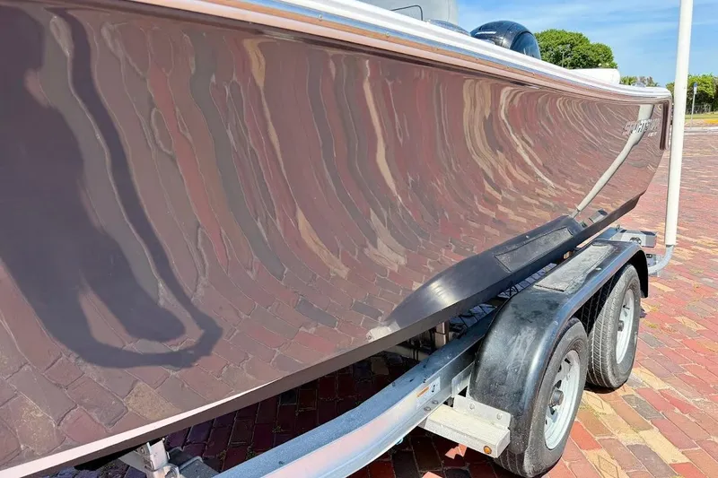 Slide: The Image of 2020 Sportsman Heritage 211 Center Console boat on trailer, reflecting brick pavement. - 6