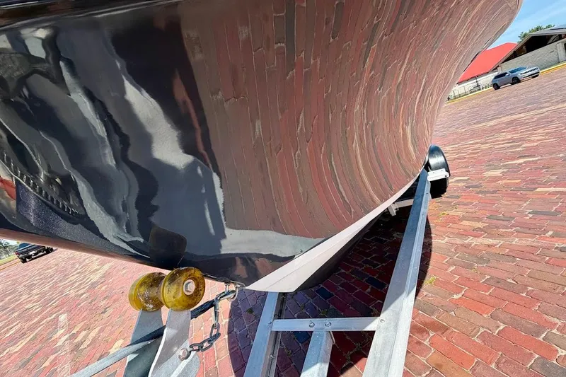 Slide: The Image of 2020 Sportsman Heritage 211 Center Console boat on trailer, brick pavement background. - 7
