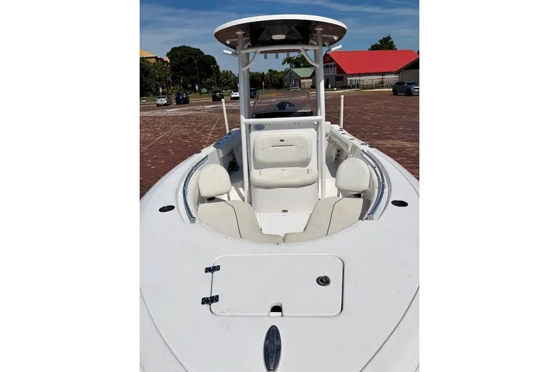 Slide: The Image of 2020 Sportsman Heritage 211 Center Console boat with white seating and console. - 8