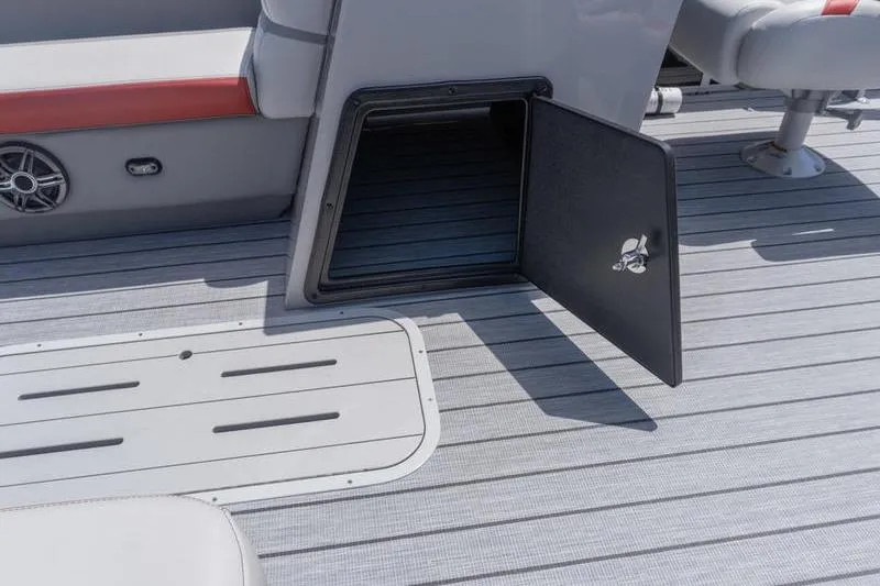 Slide: The Image of Open storage compartment on 2026 SunCatcher Select 322SL boat deck. - 10