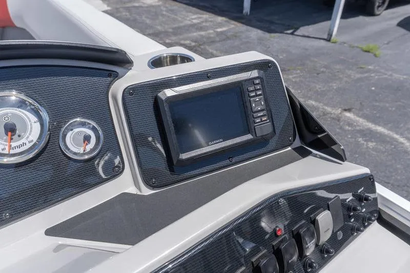 Slide: The Image of Dashboard of 2026 SunCatcher Select 322SL boat with Garmin display and gauges. - 13