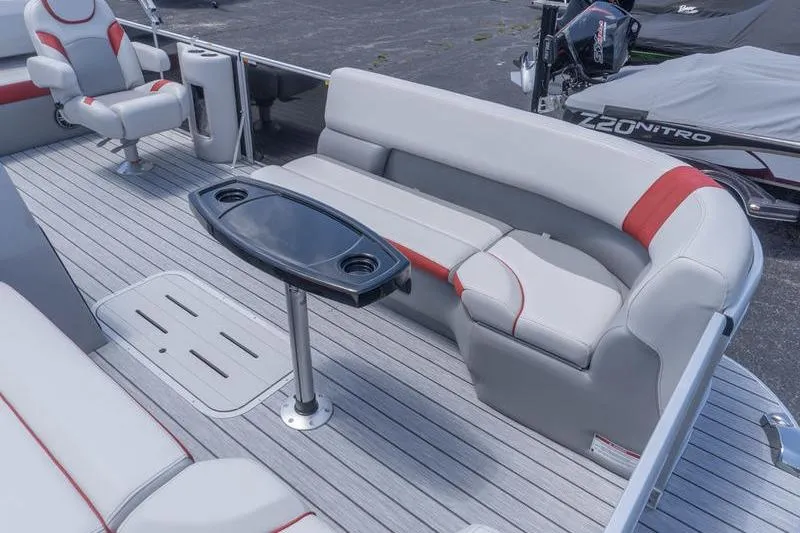 Slide: The Image of 2026 SunCatcher Select 322SL pontoon boat interior with seating and table. - 19