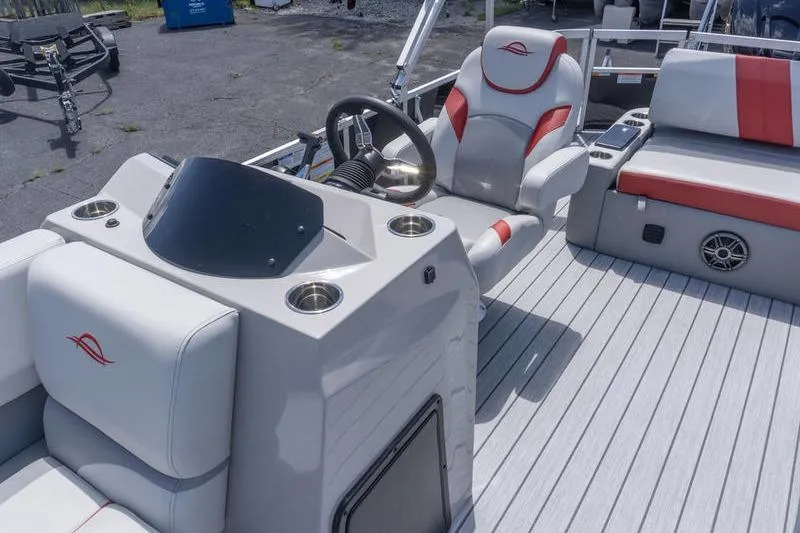 Slide: The Image of 2026 SunCatcher Select 322SL boat interior with steering wheel and seating. - 21