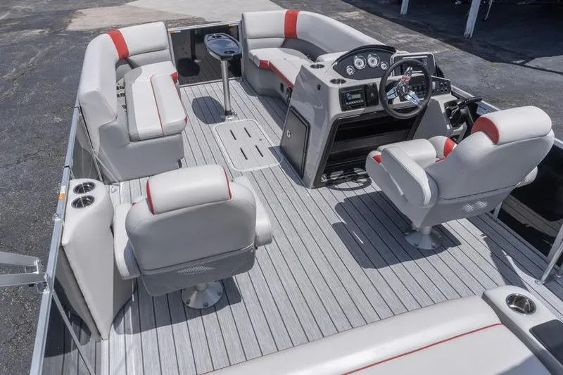 Slide: The Image of 2026 SunCatcher Select 322SL pontoon boat interior with gray seating and modern dashboard. - 7