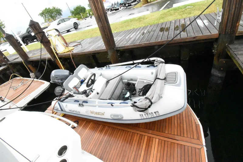 Slide: The Image of 2024 OKEAN 52 boat docked on wooden pier, featuring sleek design and modern amenities. - 16