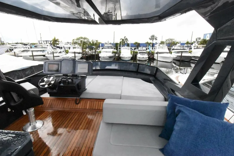 Slide: The Image of Luxurious 2024 OKEAN 52 yacht interior with modern helm and plush seating. - 26
