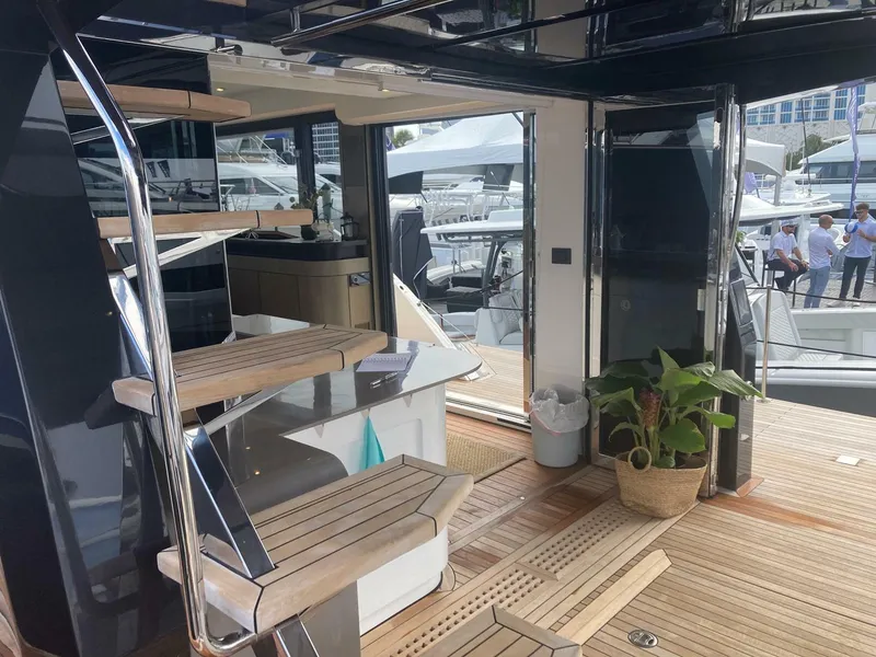Slide: The Image of Luxurious 2024 OKEAN 52 yacht interior with modern staircase and wooden flooring. - 30