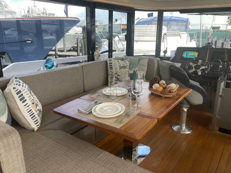 Slide: The Image of Luxurious interior of 2024 OKEAN 52 yacht with elegant dining area and helm station. - 31