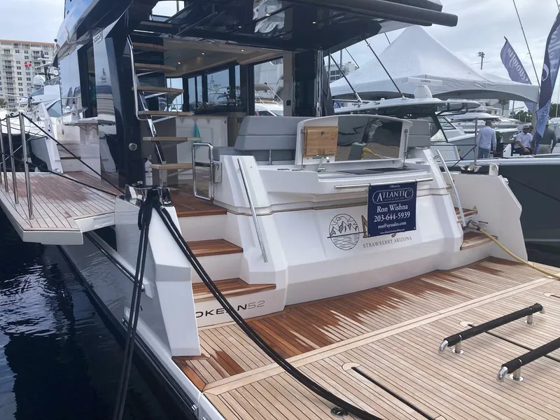 Slide: The Image of Luxury 2024 OKEAN 52 yacht with sleek design and spacious deck at marina. - 32