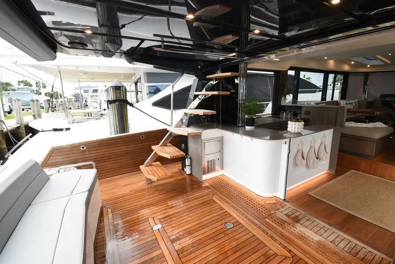Slide: The Image of Luxurious 2024 OKEAN 52 yacht interior with sleek wooden deck and modern design. - 4
