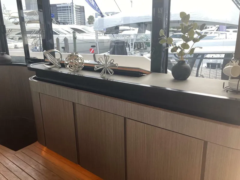 Slide: The Image of Luxurious interior of 2024 OKEAN 52 yacht with modern decor and marina view. - 41
