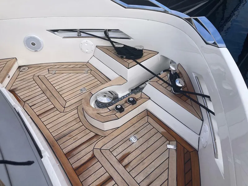Slide: The Image of 2024 OKEAN 52 yacht deck with teak flooring and sleek design. - 46