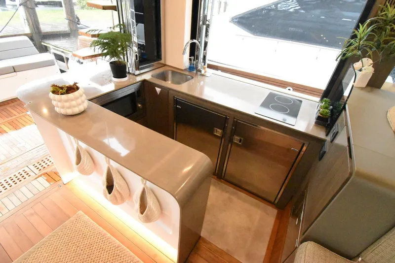 Slide: The Image of Modern kitchen interior on 2024 OKEAN 52 yacht with sleek countertops and appliances. - 8