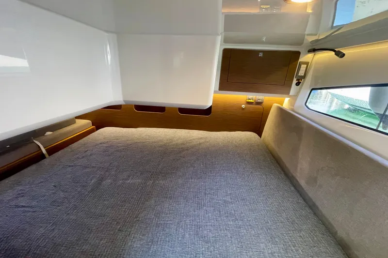 Slide: The Image of Cozy cabin interior of 2023 Beneteau Antares 11 Fly with modern design and comfortable bedding. - 23