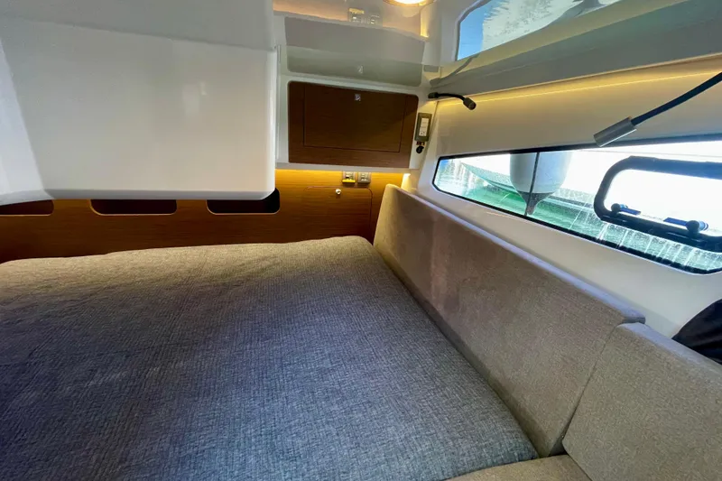 Slide: The Image of Interior cabin of 2023 Beneteau Antares 11 Fly, featuring cozy bed and modern design. - 24