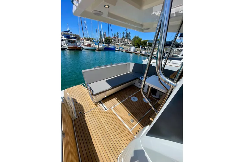 Slide: The Image of 2023 Beneteau Antares 11 Fly yacht with teak deck and seating in marina. - 29