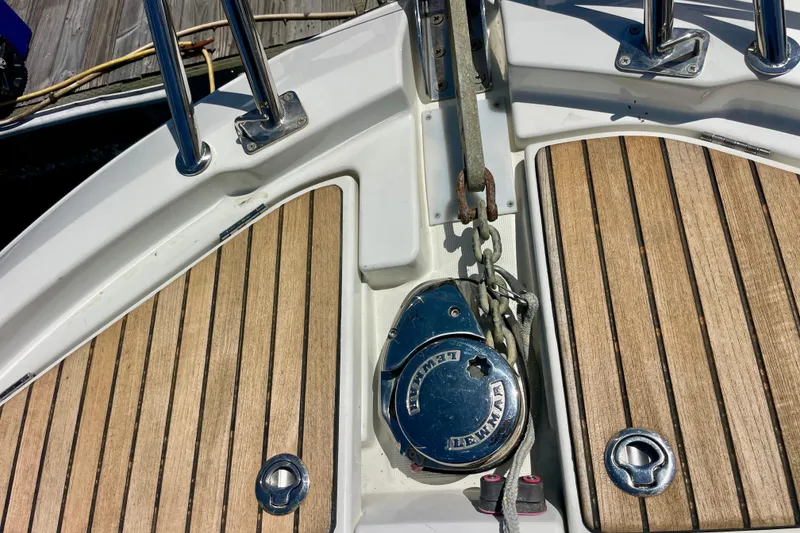 Slide: The Image of Deck of 2023 Beneteau Antares 11 Fly with anchor chain and teak flooring. - 8