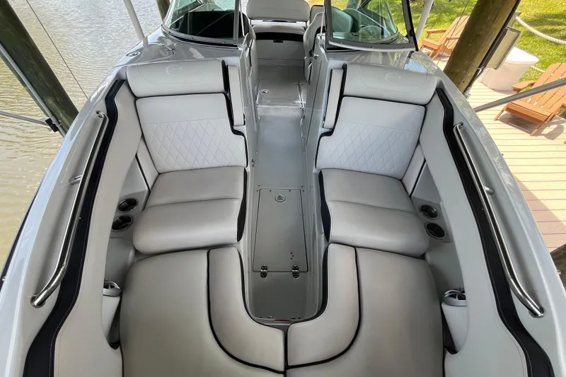 Slide: The Image of 2022 Crownline 260 XSS boat interior with luxurious seating and sleek design. - 11