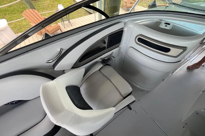 Slide: The Image of Interior of 2022 Crownline 260 XSS boat with modern seating and sleek design. - 24