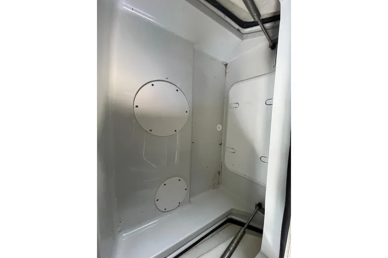 Slide: The Image of 2022 Crownline 260 XSS boat storage compartment interior view. - 27