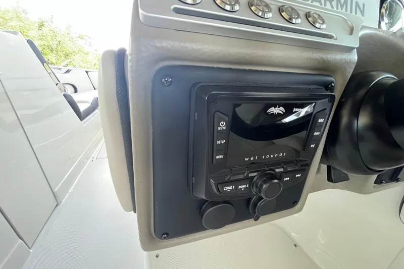 Slide: The Image of 2022 Crownline 260 XSS boat dashboard featuring Wet Sounds audio system. - 29