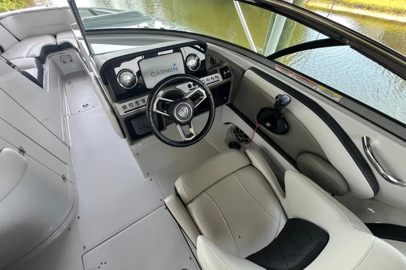 Slide: The Image of Interior view of 2022 Crownline 260 XSS boat with Garmin navigation system. - 8