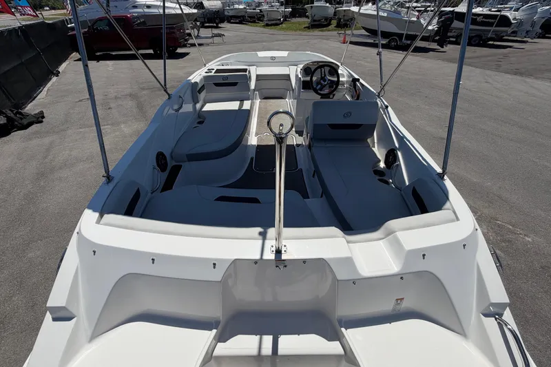 Slide: The Image of 2022 Hurricane SunDeck Sport 185 OB boat interior, showcasing spacious seating and steering console. - 12