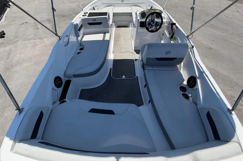 Slide: The Image of 2022 Hurricane SunDeck Sport 185 OB boat interior with seating and steering console. - 14