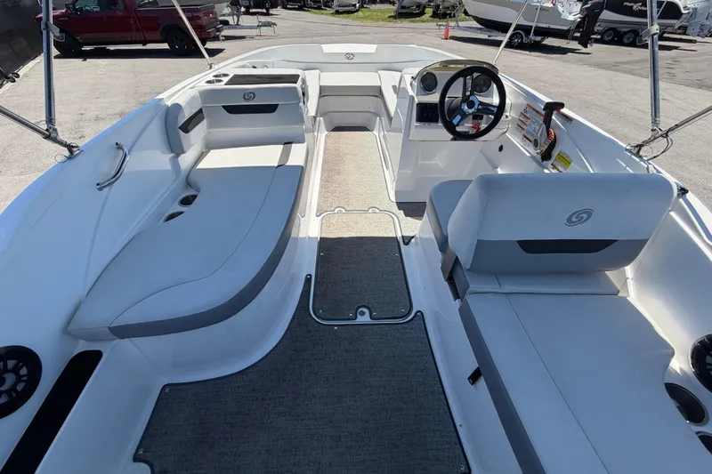 Slide: The Image of 2022 Hurricane SunDeck Sport 185 OB boat interior with seating and steering wheel. - 15