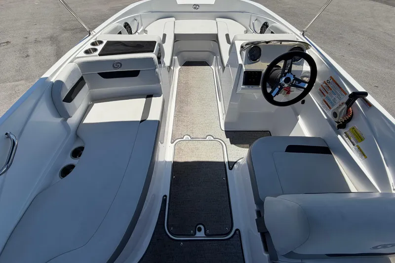 Slide: The Image of 2022 Hurricane SunDeck Sport 185 OB boat interior with seating and steering wheel. - 16