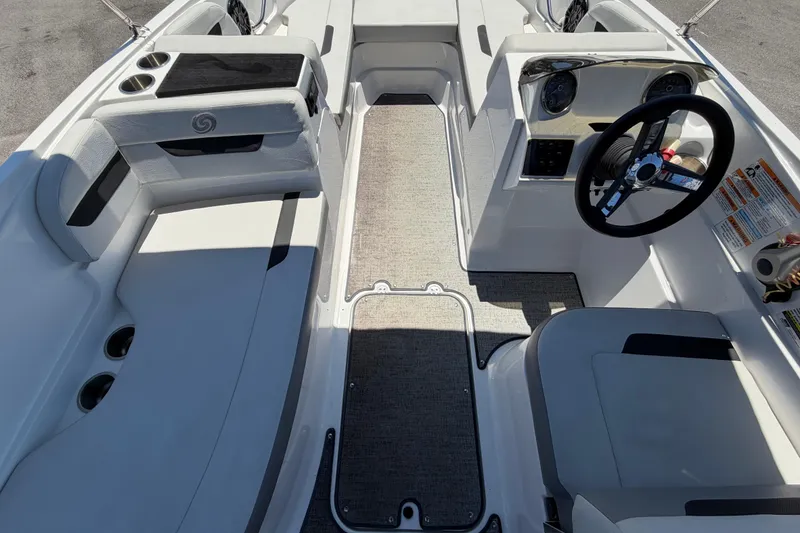 Slide: The Image of 2022 Hurricane SunDeck Sport 185 OB boat interior with steering wheel and seating area. - 23
