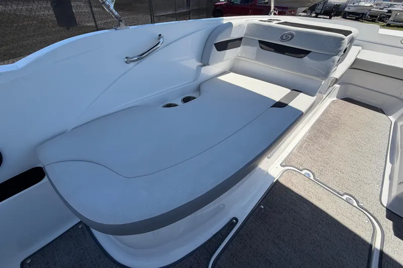 Slide: The Image of 2022 Hurricane SunDeck Sport 185 OB boat interior with cushioned seating and cup holders. - 24
